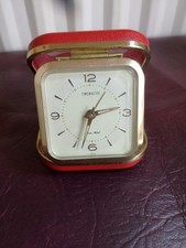 Small travel alarm clock.